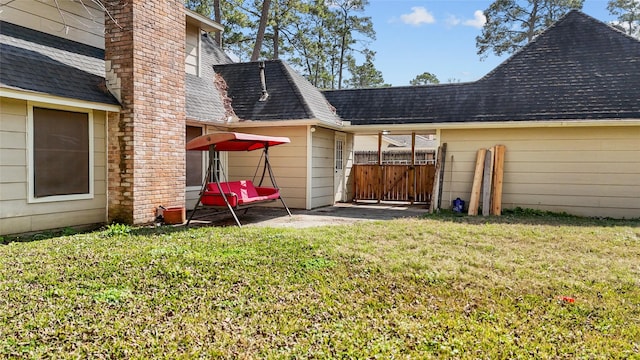 rear view of house with a lawn