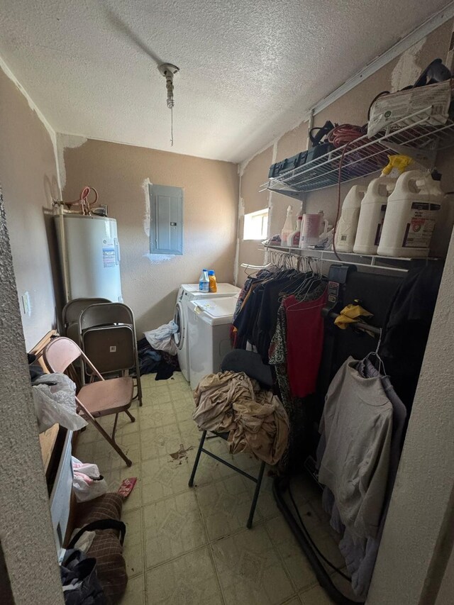 laundry area with electric panel, separate washer and dryer, water heater, and a textured ceiling