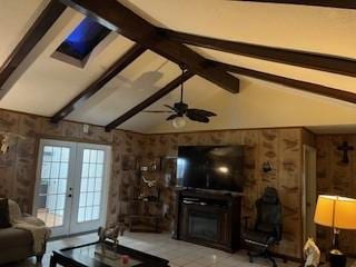 living room with french doors, ceiling fan, and lofted ceiling with beams