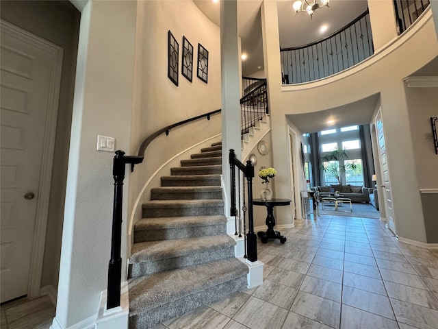 foyer featuring a towering ceiling