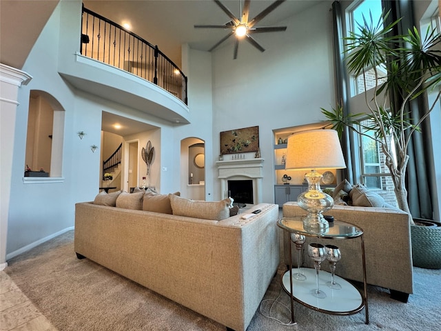 living room featuring carpet and ceiling fan