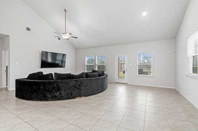 living room featuring light tile patterned floors, high vaulted ceiling, and ceiling fan