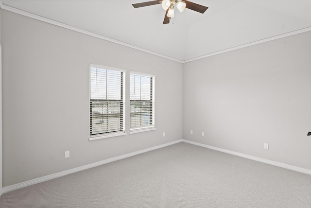 carpeted empty room with vaulted ceiling and ceiling fan