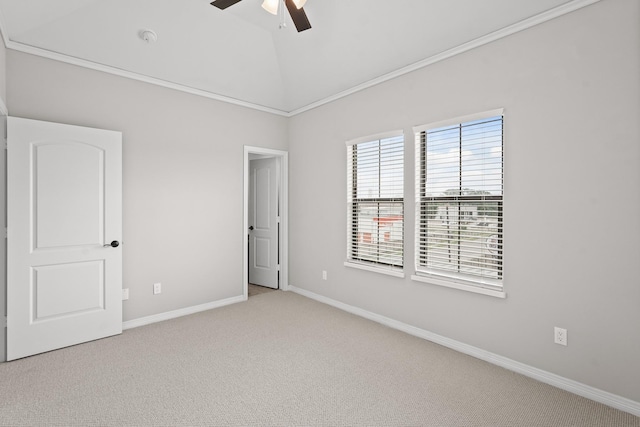 carpeted empty room with vaulted ceiling and ceiling fan