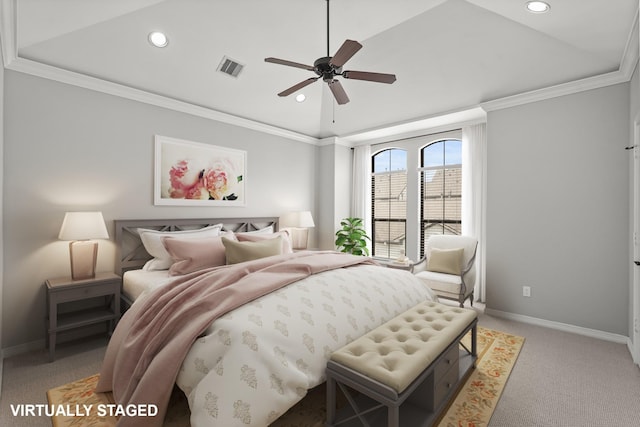 bedroom with a raised ceiling, ornamental molding, light colored carpet, and ceiling fan