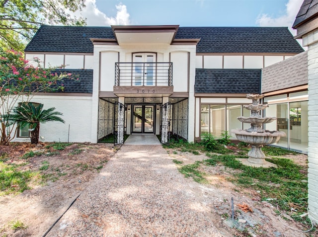 view of front of home with a balcony