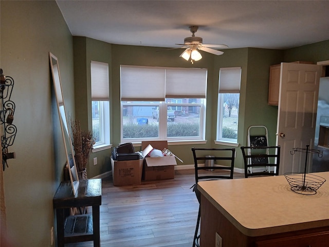 kitchen with light hardwood / wood-style flooring and ceiling fan