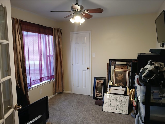 carpeted bedroom with ceiling fan