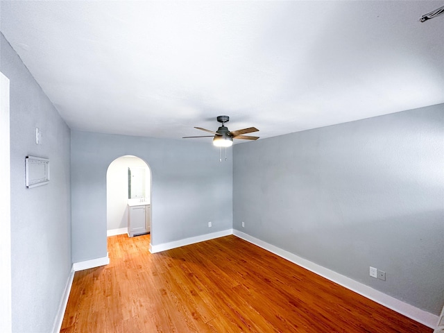 empty room featuring ceiling fan and light hardwood / wood-style floors