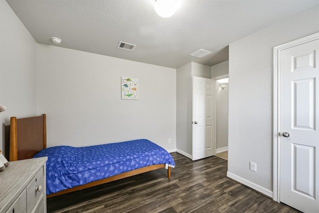 bedroom featuring dark hardwood / wood-style floors