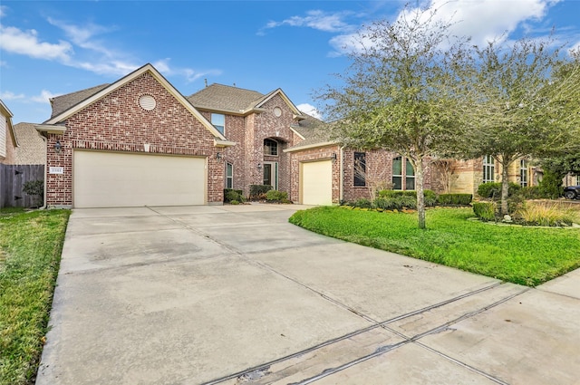 view of front of home featuring a garage and a front lawn