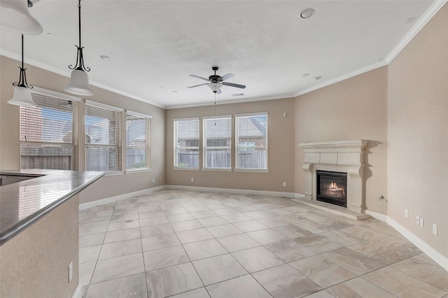 unfurnished living room with ornamental molding and ceiling fan