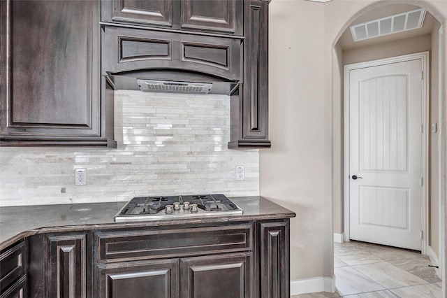 kitchen with dark brown cabinetry and stainless steel gas cooktop