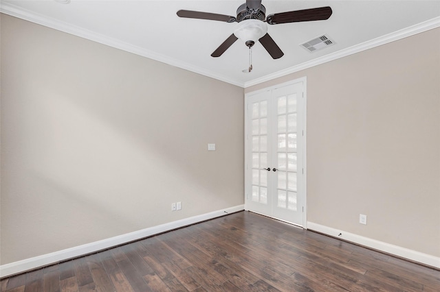 empty room featuring french doors, crown molding, and dark wood-type flooring