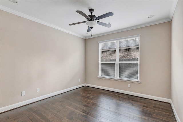 spare room with ornamental molding, dark wood-type flooring, and ceiling fan