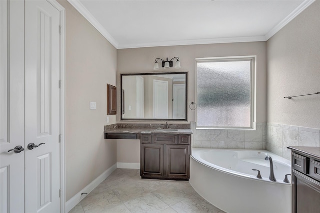 bathroom featuring crown molding, a healthy amount of sunlight, vanity, and a bathtub