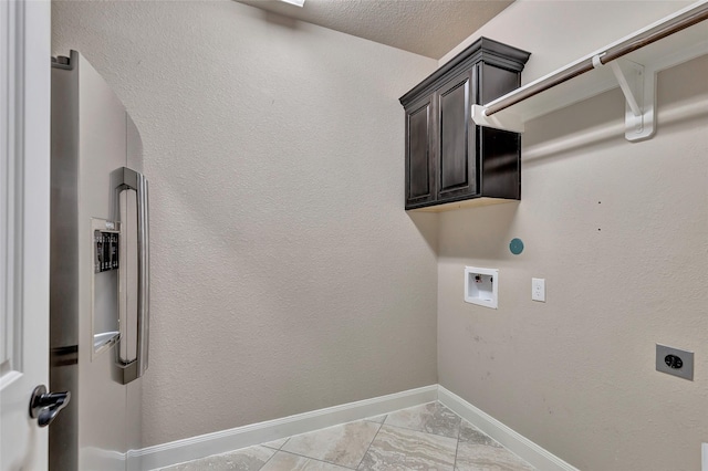 clothes washing area with cabinets, washer hookup, and hookup for an electric dryer