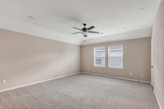 spare room with carpet floors and ceiling fan