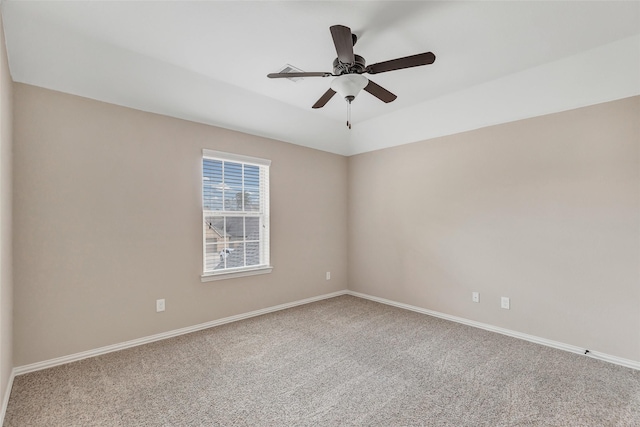 empty room with ceiling fan and carpet