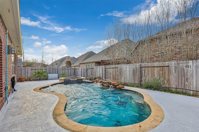 view of swimming pool featuring an in ground hot tub, pool water feature, and a patio