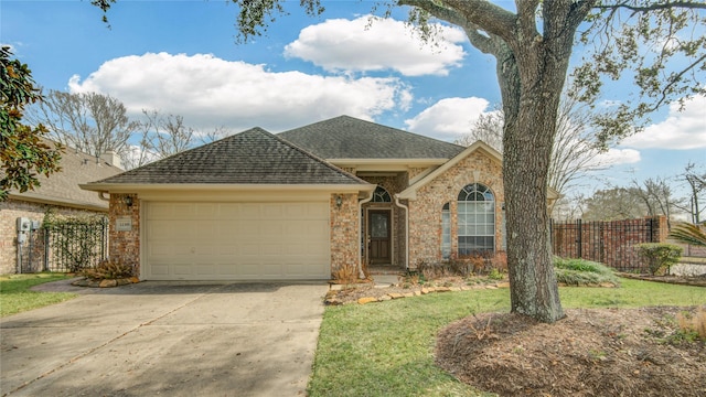 view of front facade featuring a garage and a front lawn