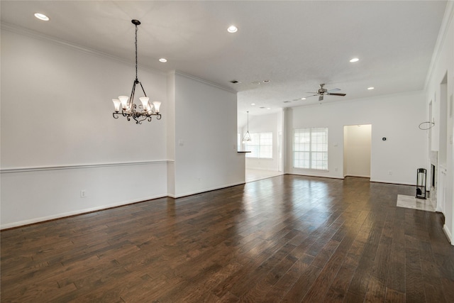 unfurnished room with ornamental molding, ceiling fan with notable chandelier, and dark hardwood / wood-style flooring