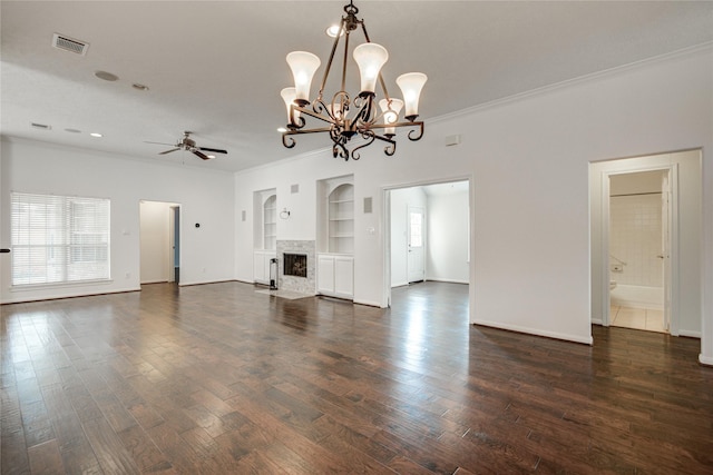 unfurnished living room with built in shelves, ornamental molding, dark hardwood / wood-style floors, and ceiling fan with notable chandelier