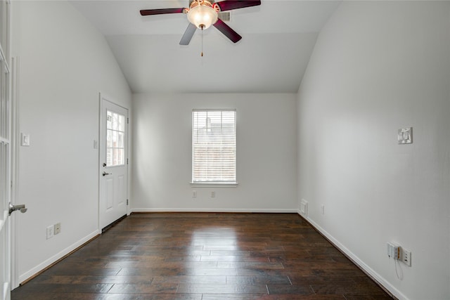 empty room with ceiling fan, lofted ceiling, and dark hardwood / wood-style flooring