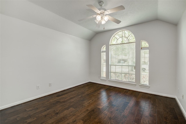 empty room featuring hardwood / wood-style flooring, ceiling fan, and vaulted ceiling