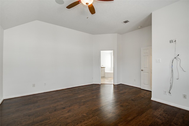 unfurnished room featuring dark wood-type flooring, ceiling fan, and vaulted ceiling