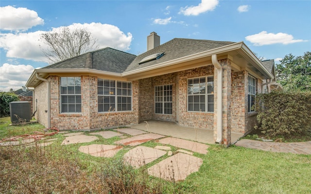 back of house with central AC and a patio area