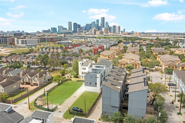 drone / aerial view featuring a residential view and a city view