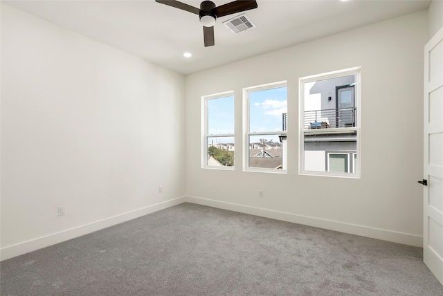 unfurnished room featuring ceiling fan and carpet flooring