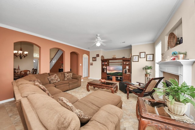 living room featuring ornamental molding and ceiling fan with notable chandelier