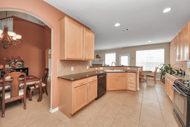 kitchen featuring dark stone countertops, backsplash, black appliances, light brown cabinetry, and kitchen peninsula