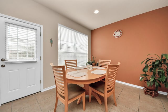 dining area with light tile patterned flooring