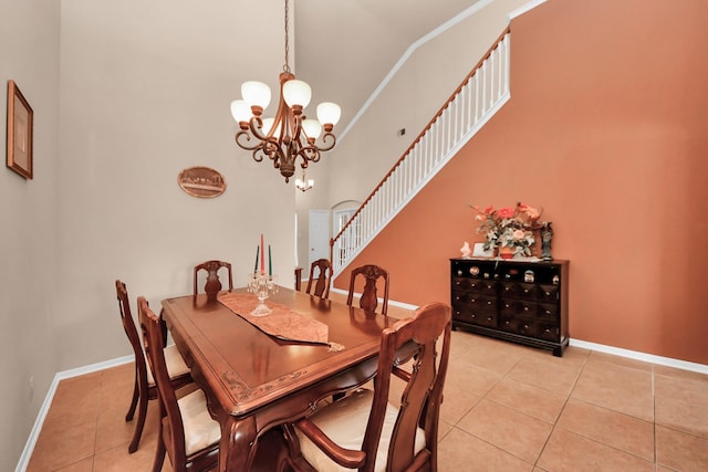 tiled dining space with an inviting chandelier