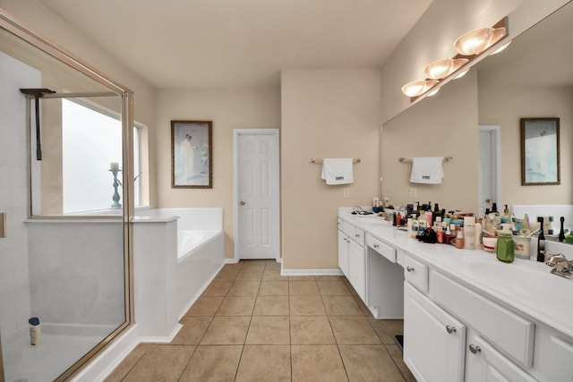 bathroom with vanity, independent shower and bath, and tile patterned flooring