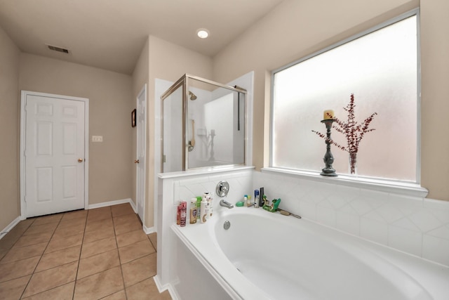 bathroom featuring tile patterned floors and plus walk in shower