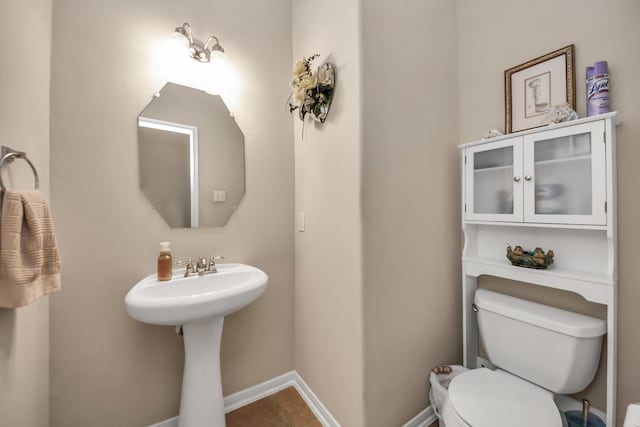 bathroom featuring tile patterned floors and toilet