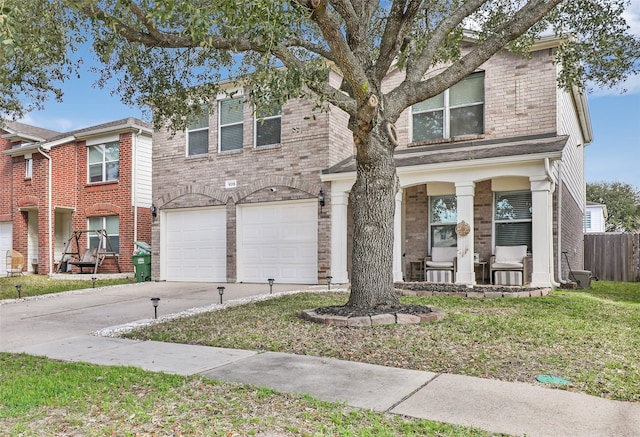 view of front property with a garage and a front lawn