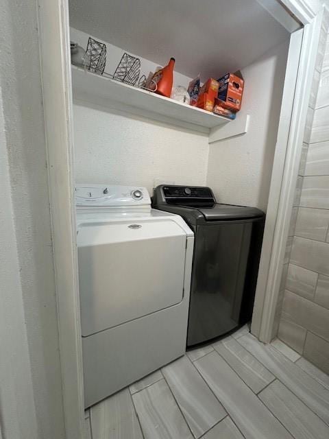 washroom featuring washing machine and dryer