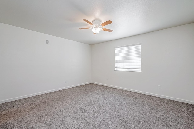 unfurnished room with carpet floors and ceiling fan