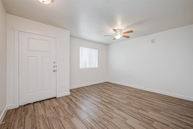 unfurnished room featuring light hardwood / wood-style floors and ceiling fan