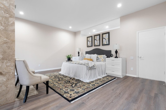 bedroom with wood-type flooring