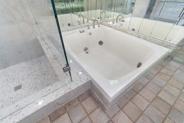 bathroom featuring tiled tub