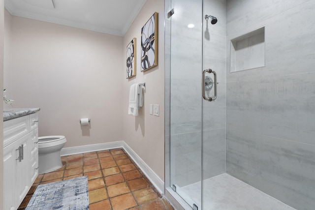 bathroom with vanity, ornamental molding, toilet, and walk in shower