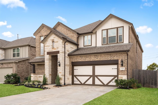 view of front of property featuring a garage and a front yard