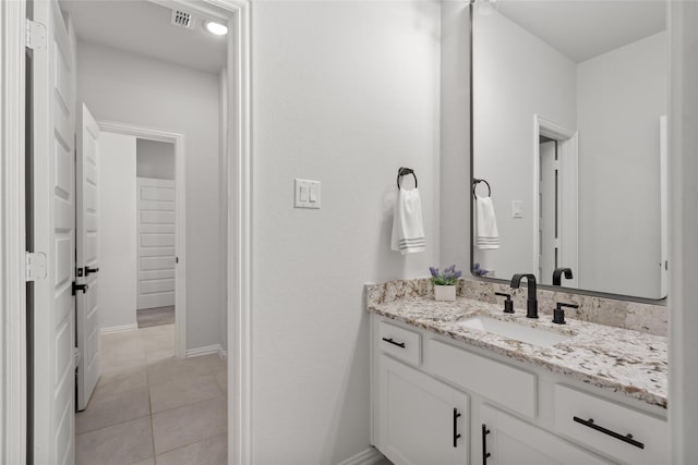 bathroom with tile patterned floors and vanity