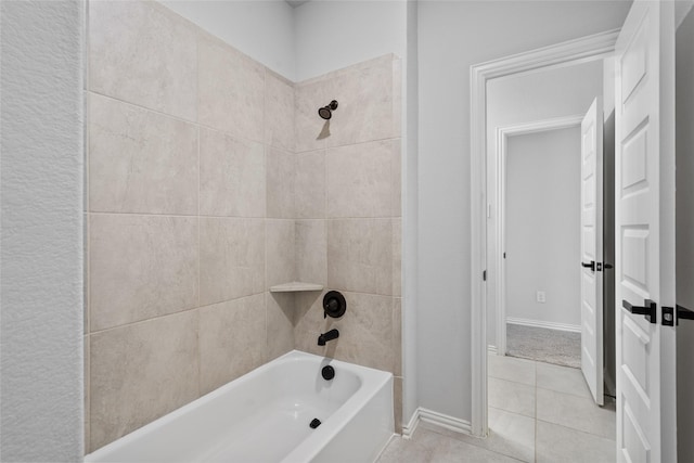 bathroom featuring tile patterned flooring and tiled shower / bath combo